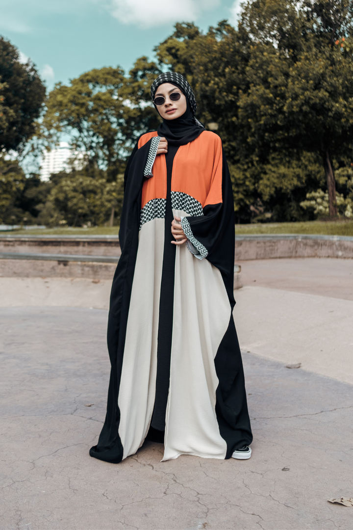 Muslimah model in Singapore wearing oversized streetwear ghutra keffiyeh batwing open abaya with hijab