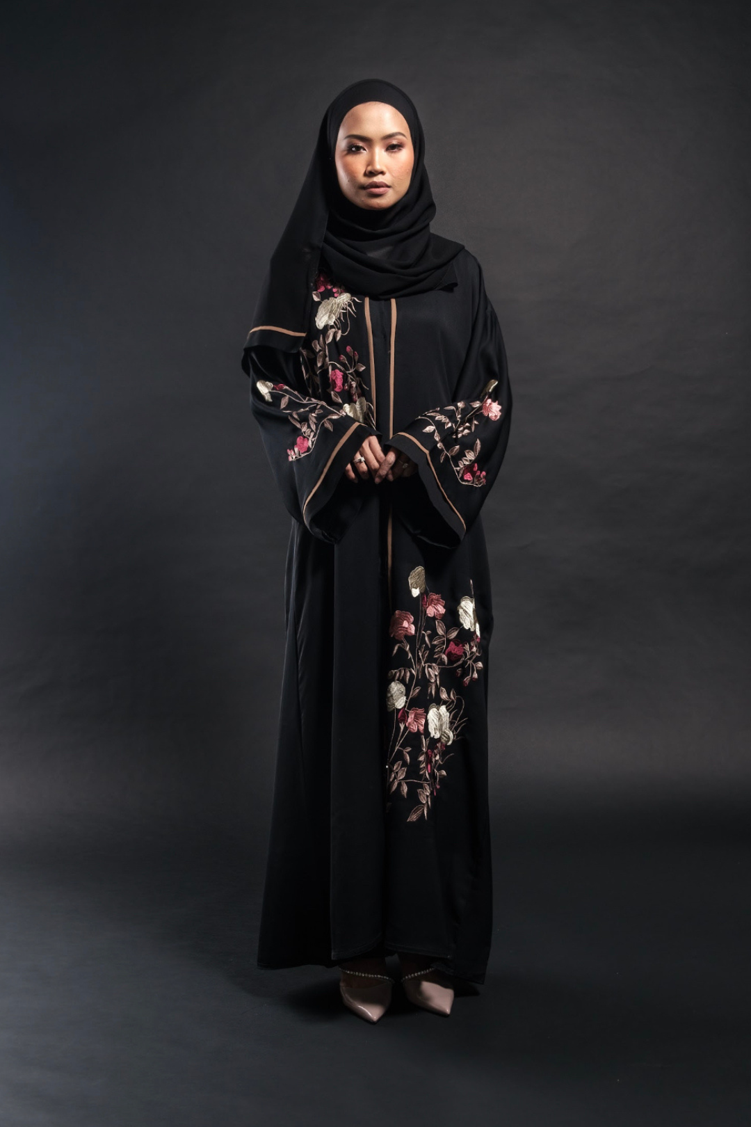 Singapore Muslimah model wearing embroidered black closed abaya in nidha with floral details