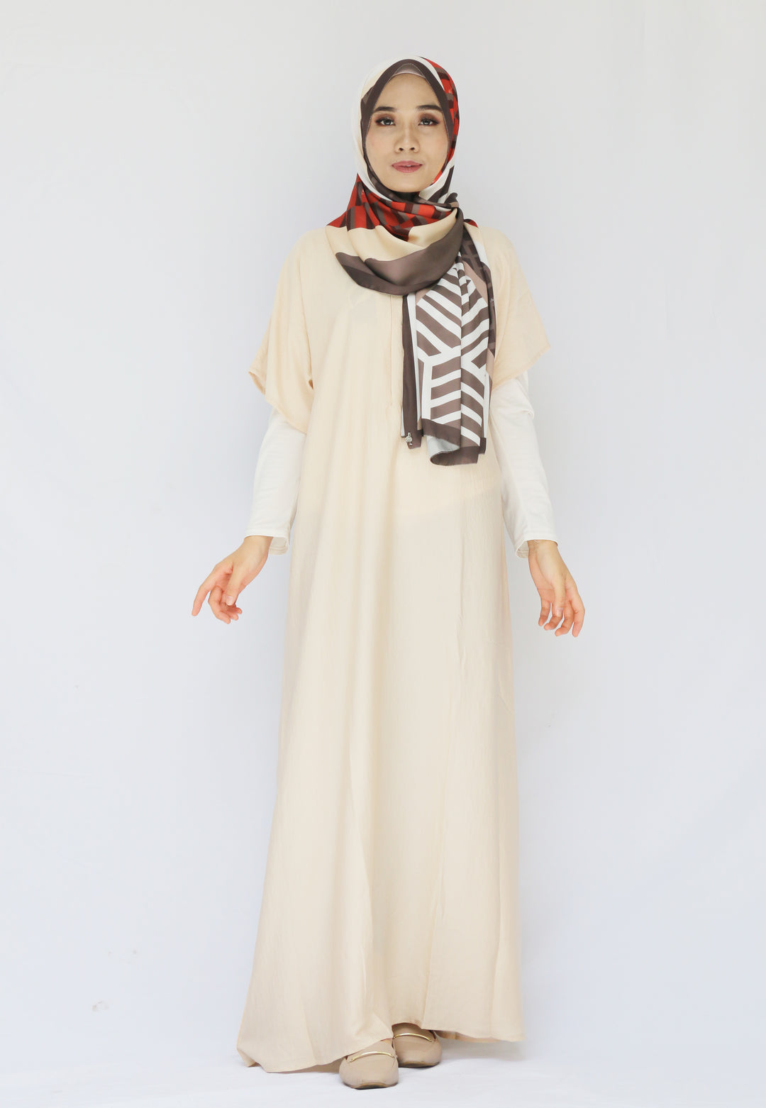 Modest Muslim Hijab Model is in cream short sleeved inner. made with crinkle silk and is wearing shawl from duck